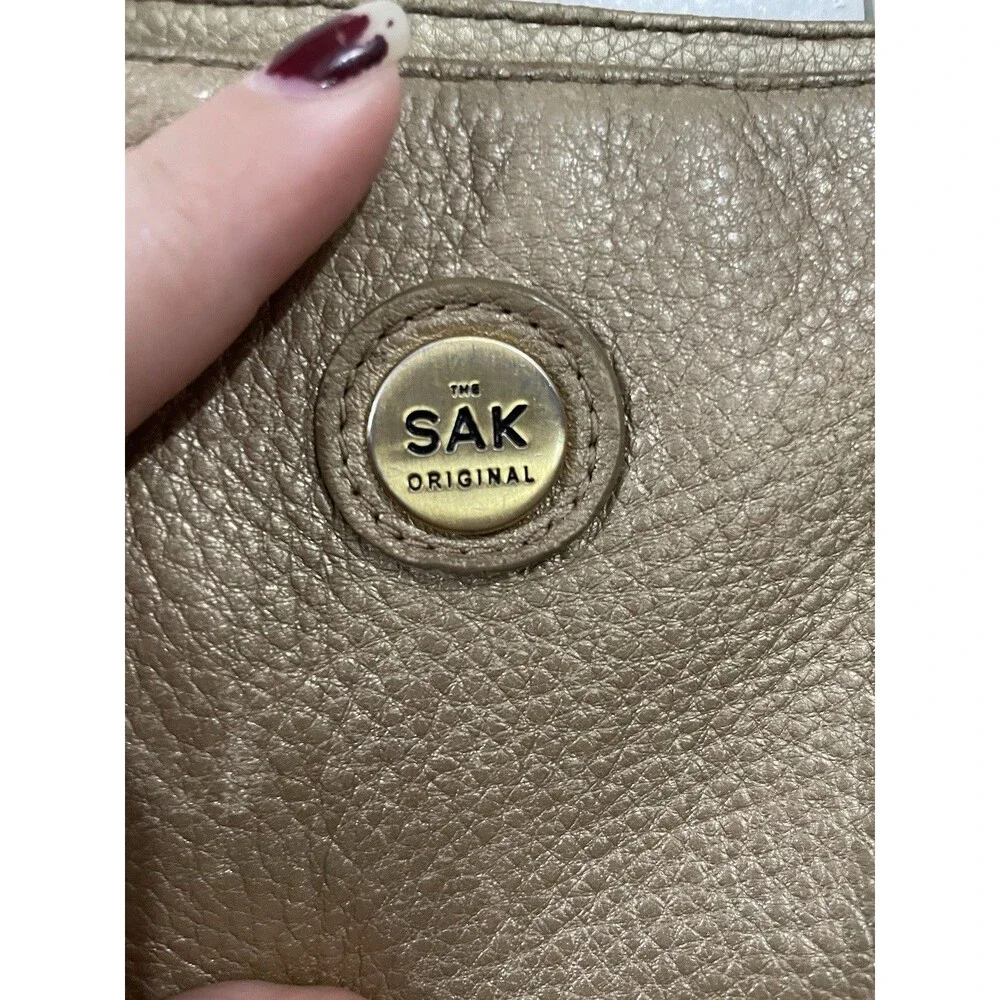 The SAK Gold Pebbled Leather Hobo Shoulder Bag Purse Single Strap Handbag